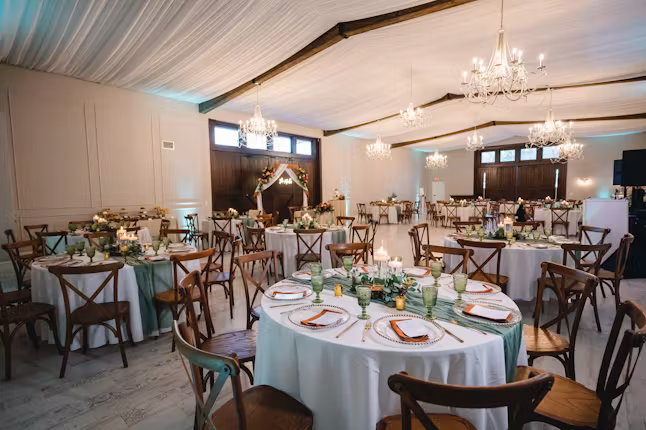 Aerial sunset view of Orlando wedding venues with romantic string lights and reception setup