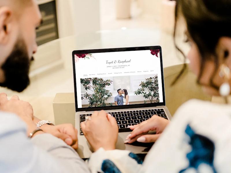 Couple researching wedding venues on laptop computer with Wedding Venue Map website